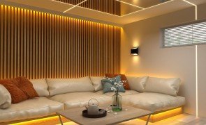 sala de casa decorada com sofá e painel ripado ao fundo